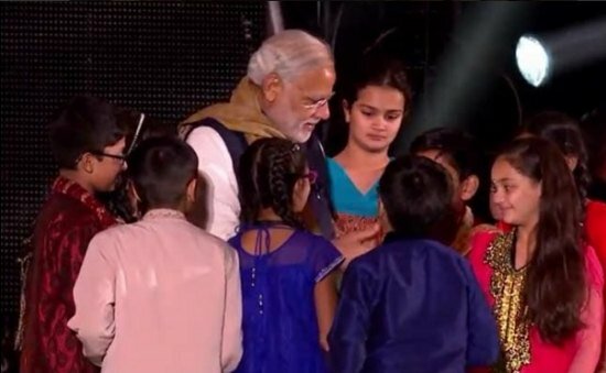 Narendra Modi UK visit 2015: Pics of electric atmosphere at Wembley Stadium for 'UKWelcomesModi' community reception Modiji meets UK Indian children after his speech at the Wembley Community Reception